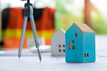 Real estate concepts,Roundabout and model house put on a house plan.の写真素材