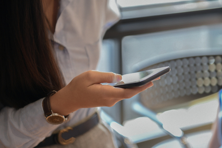 Girl office are using a smartphone.の写真素材