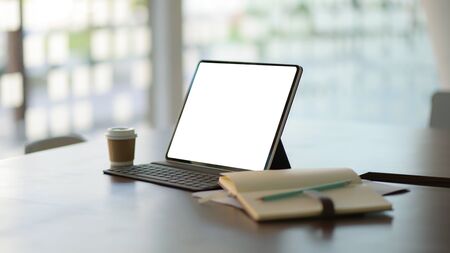 Workplace with laptop , office supplies and coffee.の写真素材