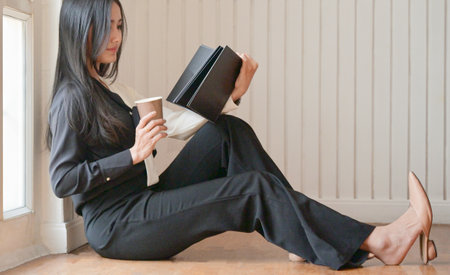 Female students are using laptop to study online at home to prevent the coronavirus outbreak.の写真素材
