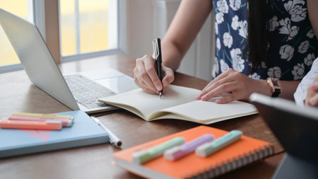 Cropped shot of a young woman recording online meetings at her home, work from home to prevent the...