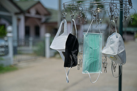 Mask on the clothes rack in the sun.の写真素材