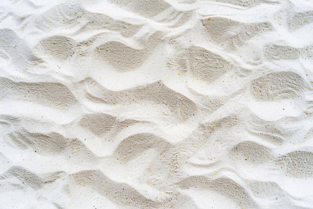 Abstract beachscape, featuring white clean textured sand as the focal point with a top view, background for various design projects.の素材