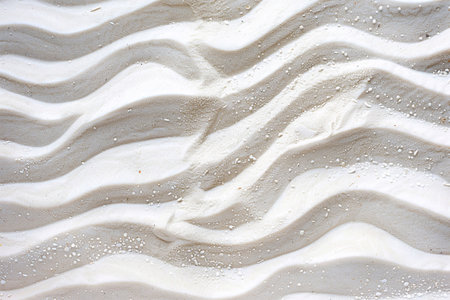 Abstract beachscape, featuring white clean textured sand as the focal point with a top view, background for various design projects.の素材