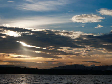 Spectacular sunset over, orange sun rising up over the horizonの写真素材