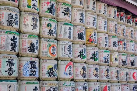 Liquor fermentation tank orderly placed in a temple in Japan, waiting for tourists to visit and take...