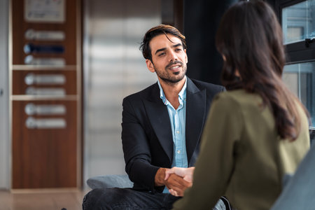 Male mature caucasian ceo businessman leader with diverse coworkers team executive managers group meeting. Multicultural professional businesspeople working together on research plan boardroom.の写真素材