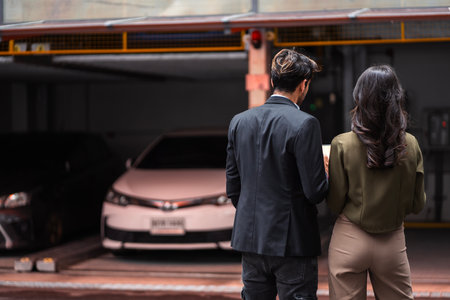 Car salesman talking to male customerの写真素材