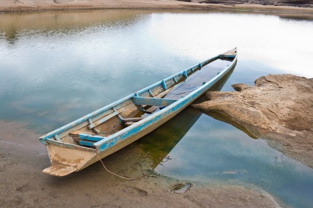 Old wooden boat along the lake shore.の写真素材
