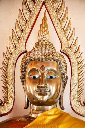 A statue of Buddha in a Buddhist temple の写真素材