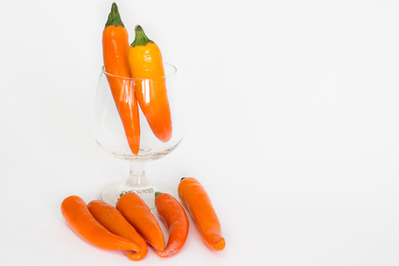 orange hot chilis isolatedの写真素材