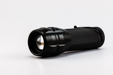 Black Flashlight on white backgroundの写真素材