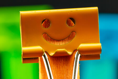 close up yellow binder clips on Ice cream sticks