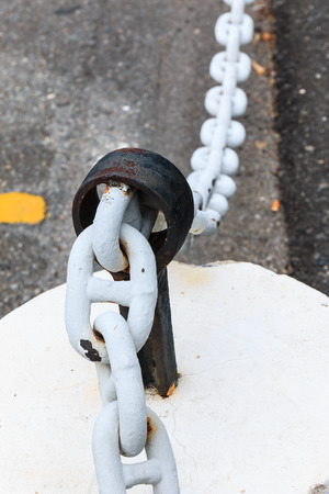 close up chain fences and cement blockの写真素材