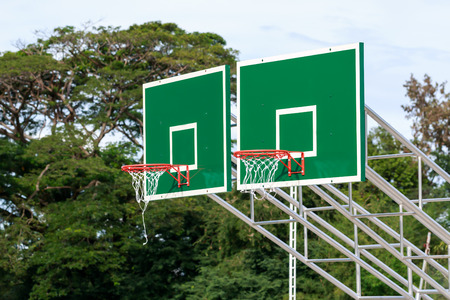Twin basketball hoop stand at playground in park