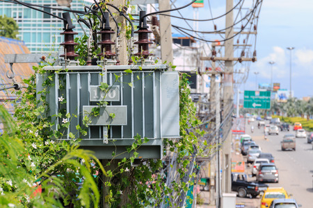 PATTAYA, NOVEMBER 5: Transformer on high power station covered with weeds at North Pattaya Road on November 5, 2014 in Pattaya,Thailand. Pattaya city is famous about sea sport and night life entertainment.のeditorial素材
