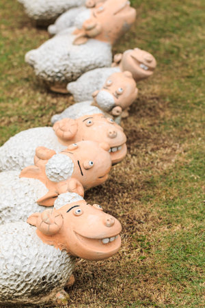 sheep sculpture is on grass backgroundの写真素材