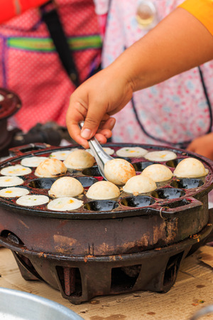 Doing Thai traditional  dessert, coconut milk with powder friedの写真素材