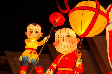 PATTAYA,THAILAND - APRIL 30 :The colorful Chinese boy and girl in night time in The Alangkarn lanterns festival 2015 in Pattaya,Thailand on 30 April 2015のeditorial素材
