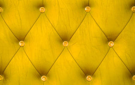 yellow sofa leather backgroundの写真素材