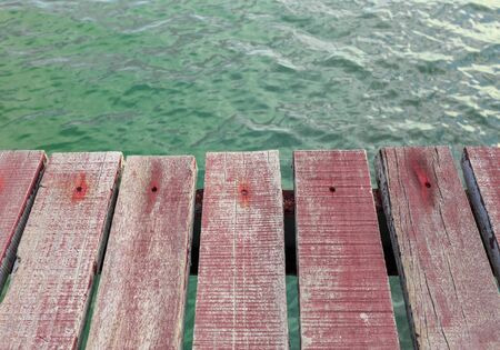 Old brown wood plank on water backgroundの写真素材