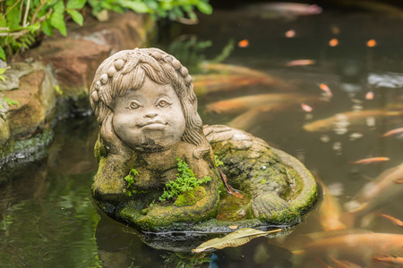 Mermaid statue in the pondの写真素材