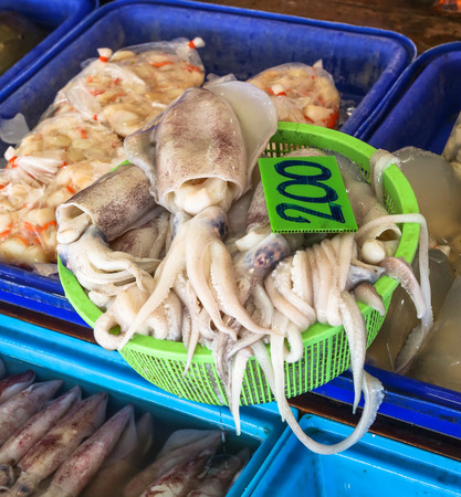 Squids in Basket at Samasarn seafood market ,Thailandの写真素材
