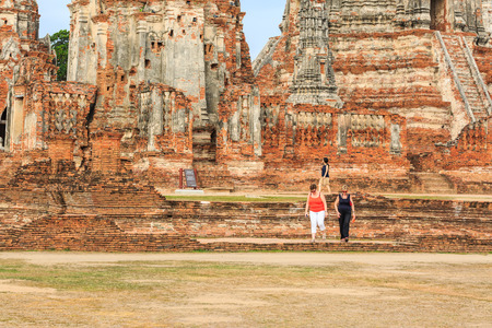 AYUTTHAYA, THAILAND - AUGUST 7, 2015 : The tourists  visiting ruin brick temple of Wat Chaiwattanaram  in Ayutthaya Historical Park, Thailand on August 7 , 2015.のeditorial素材