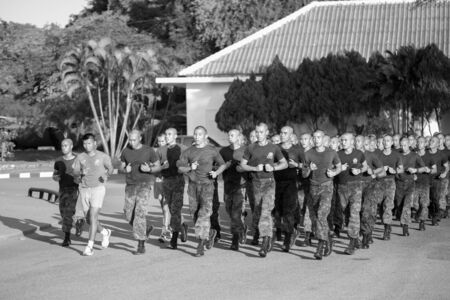 SATTAHIP, THAILAND - AUGUST 27, 2015 : A group of Royal Thai Naval Cadets run together in row along...