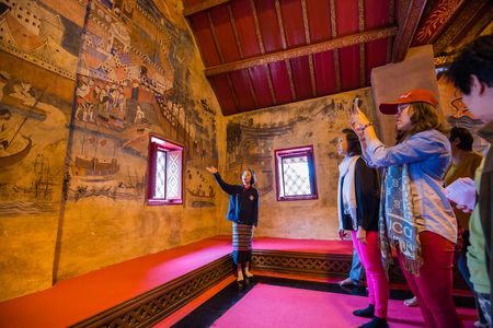 NAN , THAILAND - FEBRUARY 28, 2016 : A girl working as a tourist guide in Wat Pu Min, Buddhist Temple and Historic Site National Nan, northern of Thailand on February 28,2016のeditorial素材