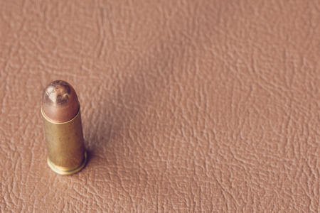 bullets on brown leather