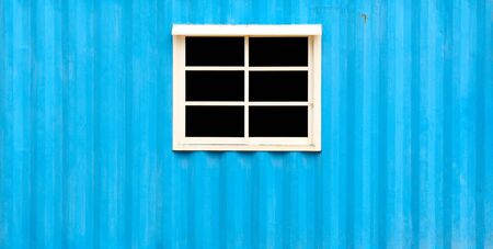 Black window and zinc blue wallsの写真素材
