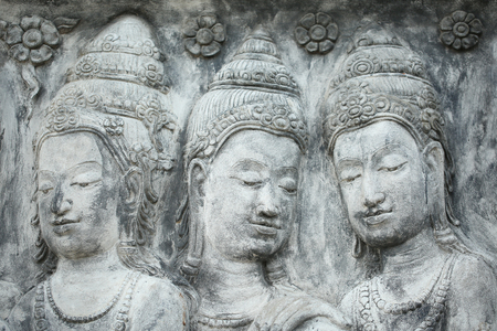 Black and white picture of Buddha statue. Buddha's face on wallの写真素材