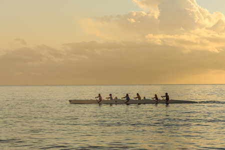 PAPEETE, FRENCH POLYNESIA - JULY 17, 2016 : Tourists are kayaking in Tahiti sea at sunset time in Tahiti Papeete, French Polynesia on July 17, 2016のeditorial素材