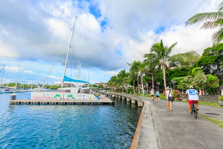 PAPEETE, FRENCH POLYNESIA - JULY 28, 2016 :  The sailing boat park in sunset time at Large seaport in Tahiti PAPEETE, FRENCH POLYNESIA on July 28, 2016のeditorial素材