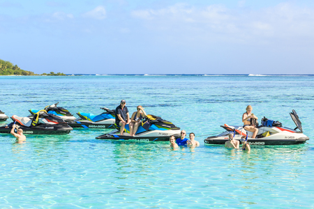 PAPEETE, FRENCH POLYNESIA - OCTOBER 26, 2016 : The Tourists swimming and driving Jet Ski  in beautiful sea at Moorae Island, Tahiti PAPEETE, FRENCH POLYNESIA.のeditorial素材