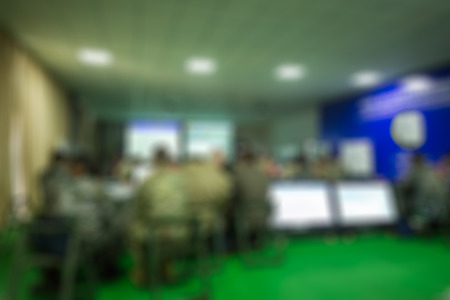 Military blur in the workplace.Table Top And Blur Office of Background.abstract blur background table work in office with computer.Abstract background of office, shallow depth of focus.の写真素材