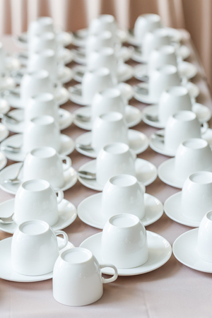 Row of white coffee cupsの写真素材