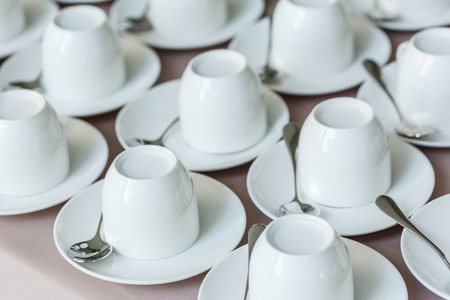 Row of white coffee cupsの写真素材
