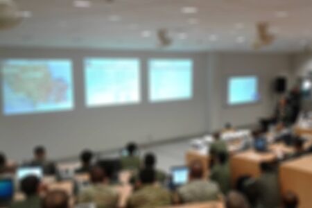 Military blur in the workplace.Table Top And Blur Office of Background.abstract blur background table work in office with computer.Abstract background of office, shallow depth of focus.の写真素材