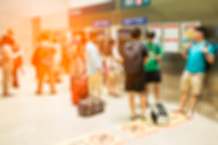 Blurred of commuters or passengers waiting buying ticket at a train stationの写真素材
