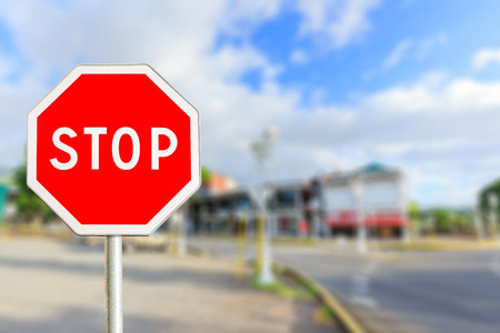 Stop sign by the City roadの写真素材