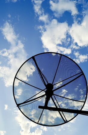 The satellite dish with the blue sky backgroundの写真素材