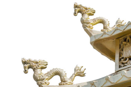two golden chinese dragon on shrine roof isolate white  background with clipping pathの写真素材