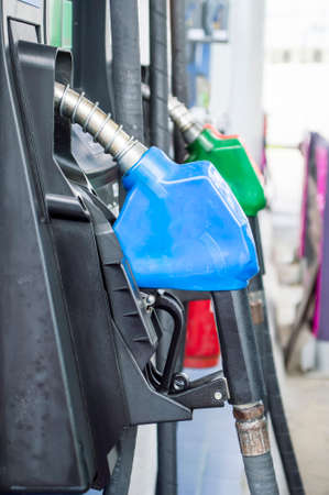 close up side view fuel nozzle fuel oil gasoline at petrol filling stationの写真素材