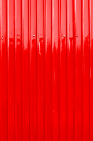 red color corrugated metal sheet as backgroundの写真素材