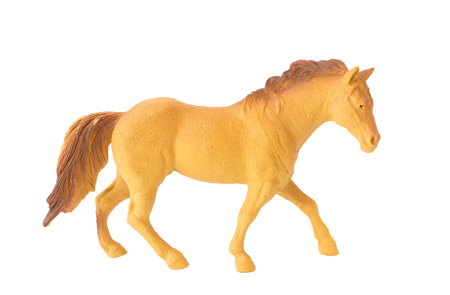 brown plastic Horse toy isolate white backgroundの写真素材