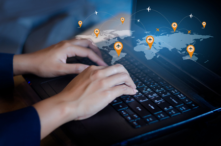 Press enter button on the computer. business logistics Communication network World map send message Connect worldwide hand keyboard Communications network map of the world Blue map Dark blue background map world global logistics networkの写真素材