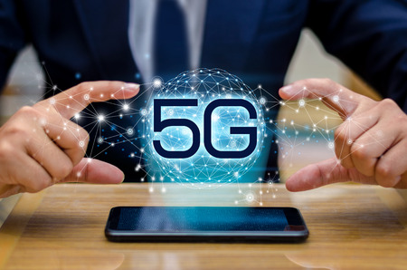phone 5g Earth businessman connect worldwide waiter hand holding an empty digital tablet with smart and 5G network connection conceptの写真素材