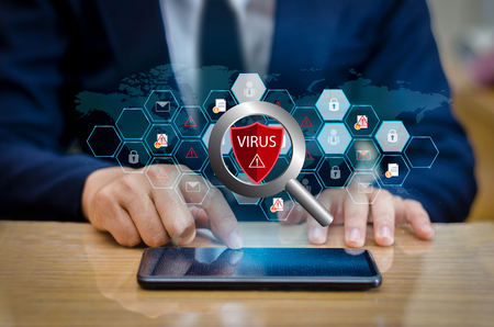 Red Shield Virus Internet phone Smartphone is protected from hacker attacks, Firewall Businesspeople press the protected phone on the internet. space put messageの写真素材